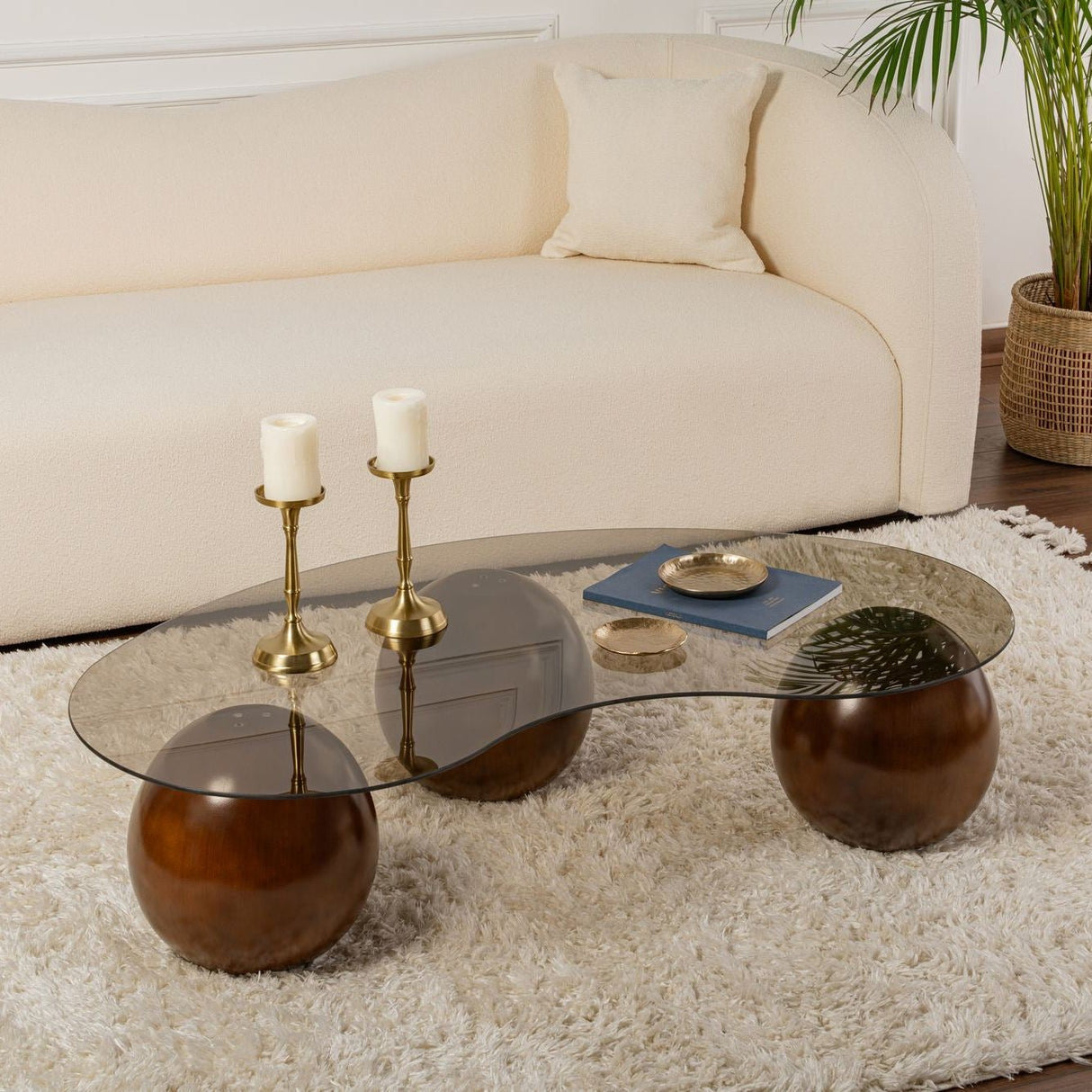 Tavolino organico vetro colorato bronzo gambe a sfera in noce Sfera 120x70 cm