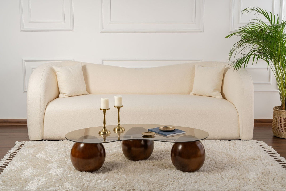 Tavolino organico vetro colorato bronzo gambe a sfera in noce Sfera 120x70 cm