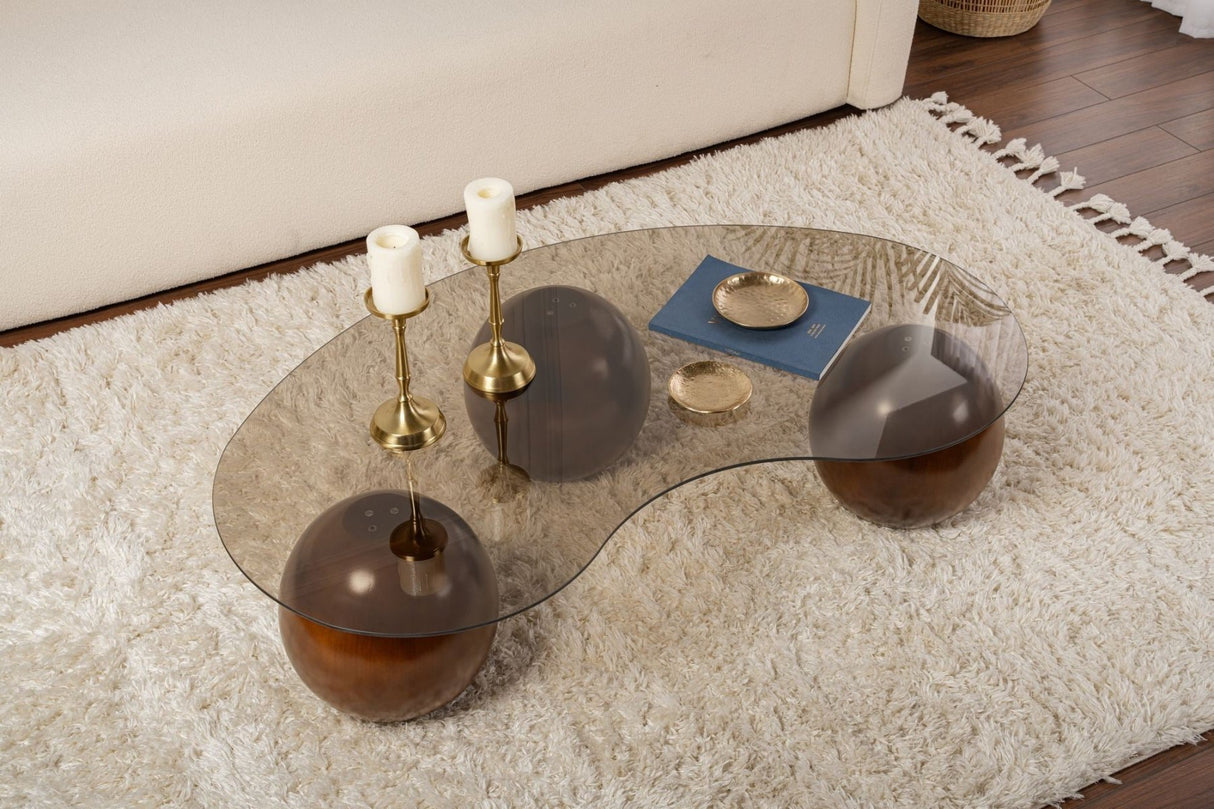 Tavolino organico vetro colorato bronzo gambe a sfera in noce Sfera 120x70 cm