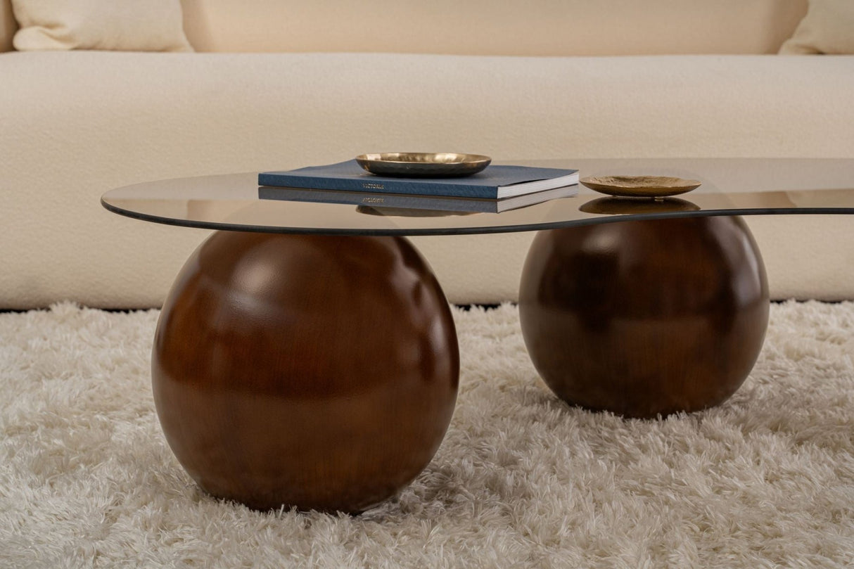 Tavolino organico vetro colorato bronzo gambe a sfera in noce Sfera 120x70 cm