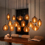 Lampada a sospensione Mali a 15 luci in vetro rigato color ambra