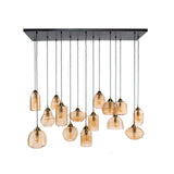 Lampada a sospensione Mali a 15 luci in vetro rigato color ambra