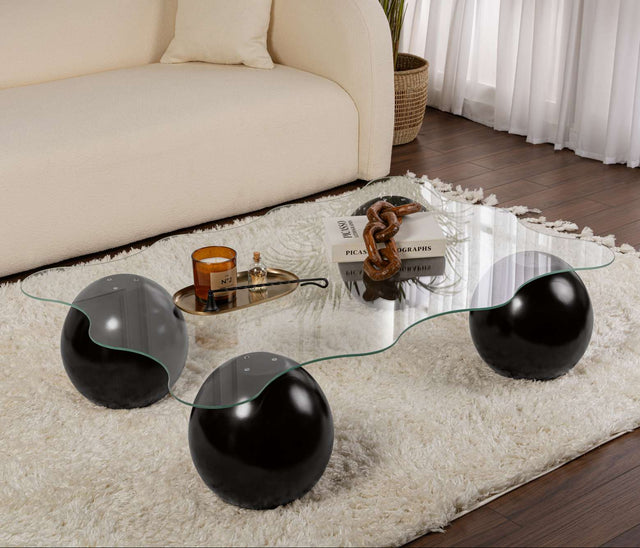 Salontafels - Golvende salontafel transparant glas zwarte bolpoten Noxa 120x80 cm - Dimehouse