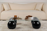 Salontafels - Golvende salontafel transparant glas zwarte bolpoten Noxa 120x80 cm - Dimehouse