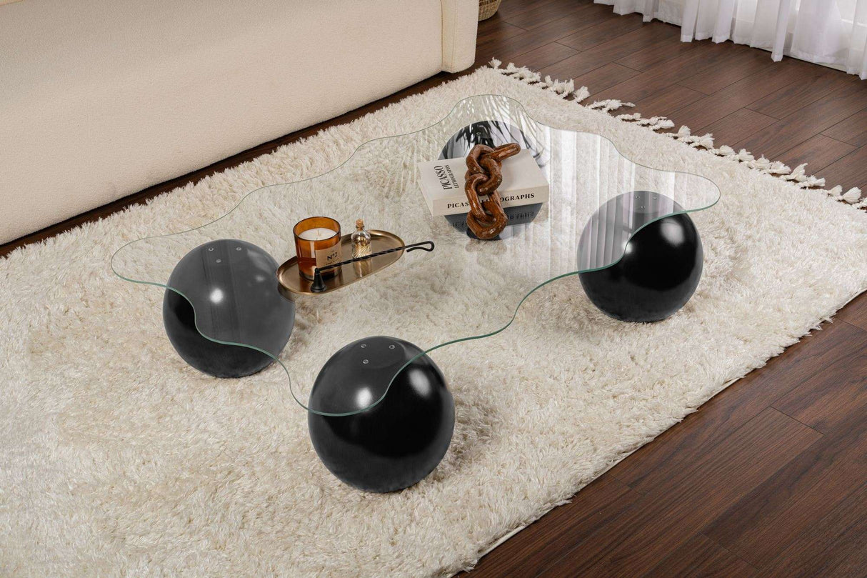 Salontafels - Golvende salontafel transparant glas zwarte bolpoten Noxa 120x80 cm - Dimehouse